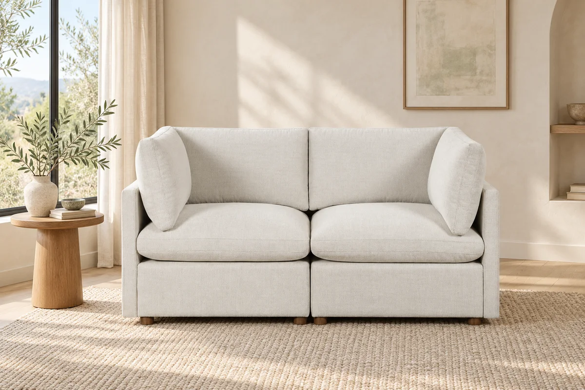 Beige two-seat loveseat in a bright living room